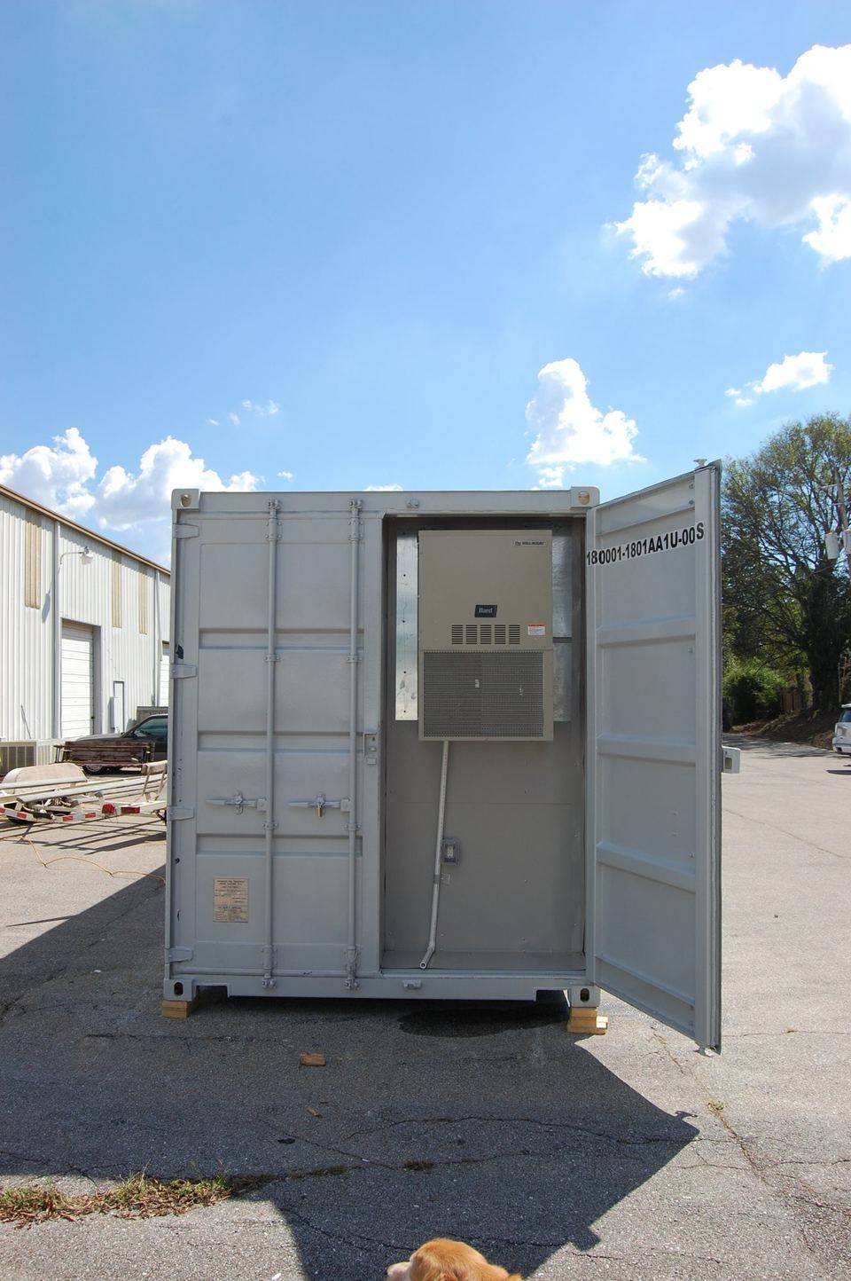 Container unit end view with doors open and HVAC unit visible