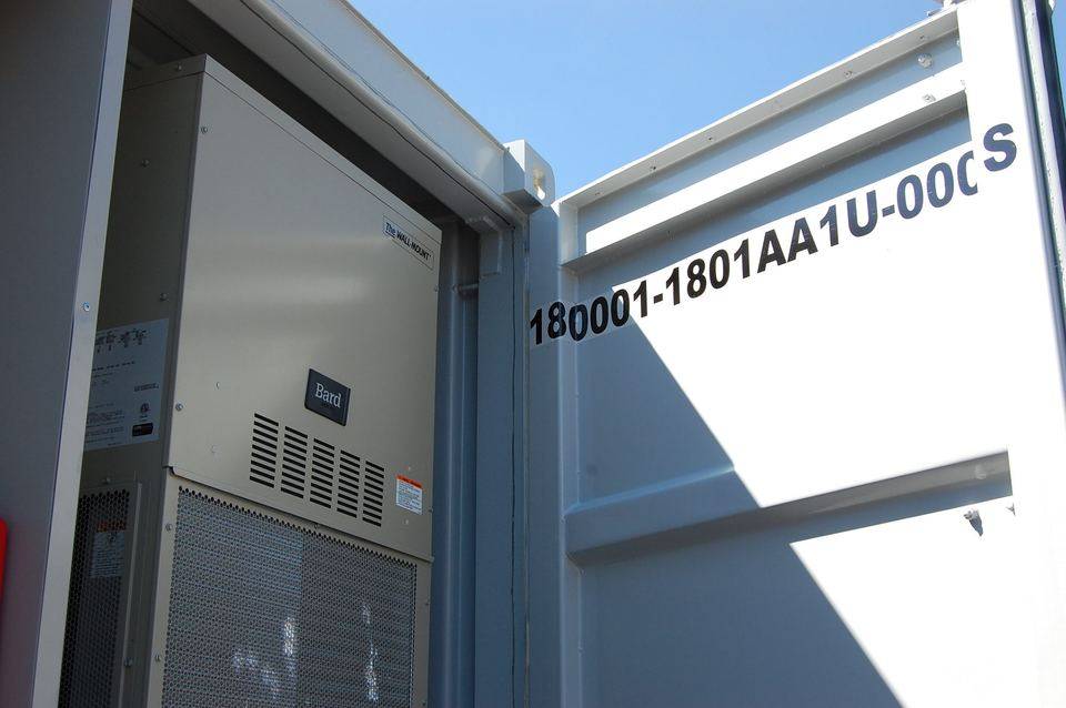 Wall-mounted HVAC unit in the container bay