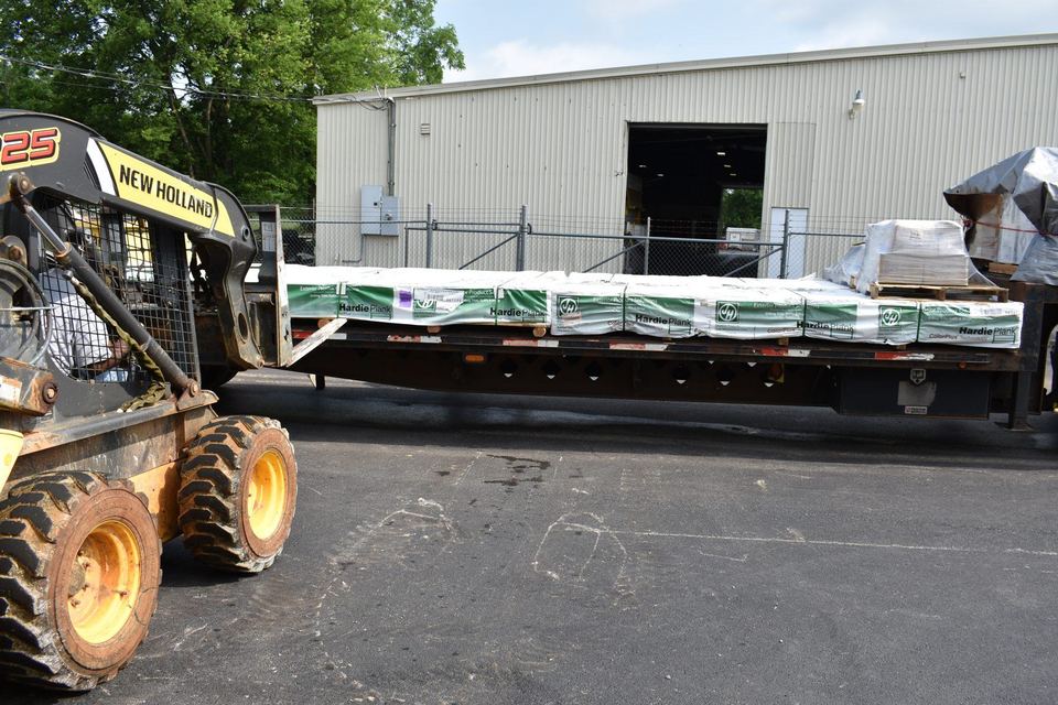 Unloading Hardie Board at Habitat of Madison County