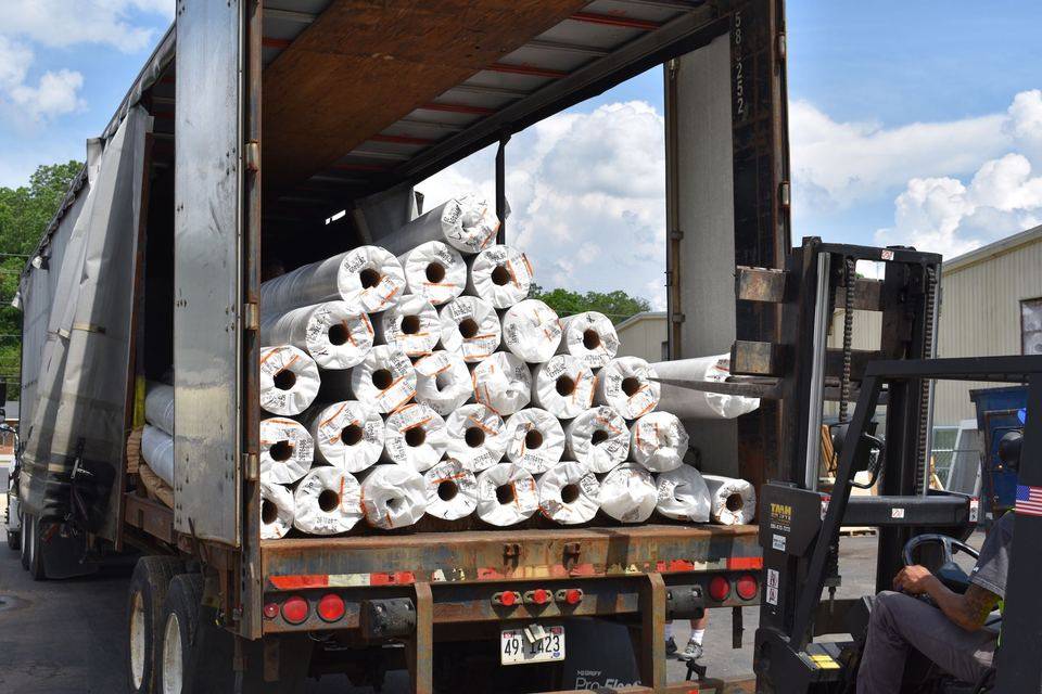 Unloading 38 Rolls of Linolieum